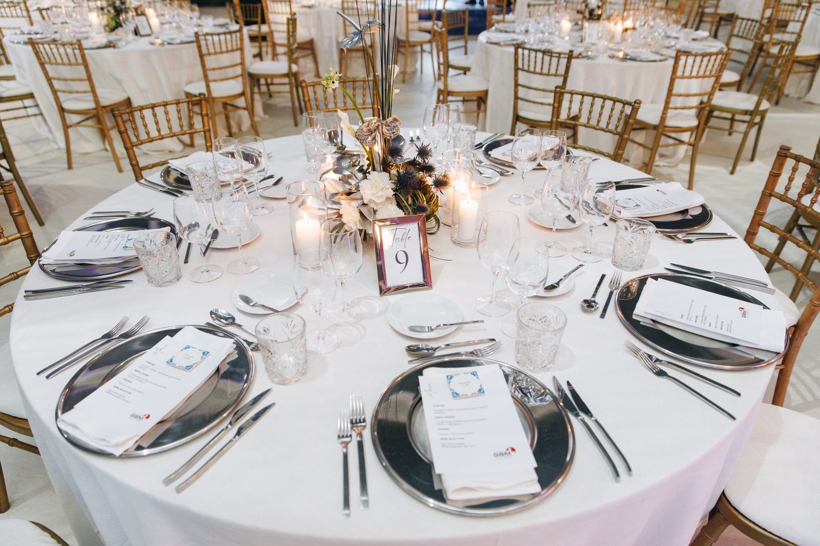 Seated gala dinner with elegant place settings for corporate event