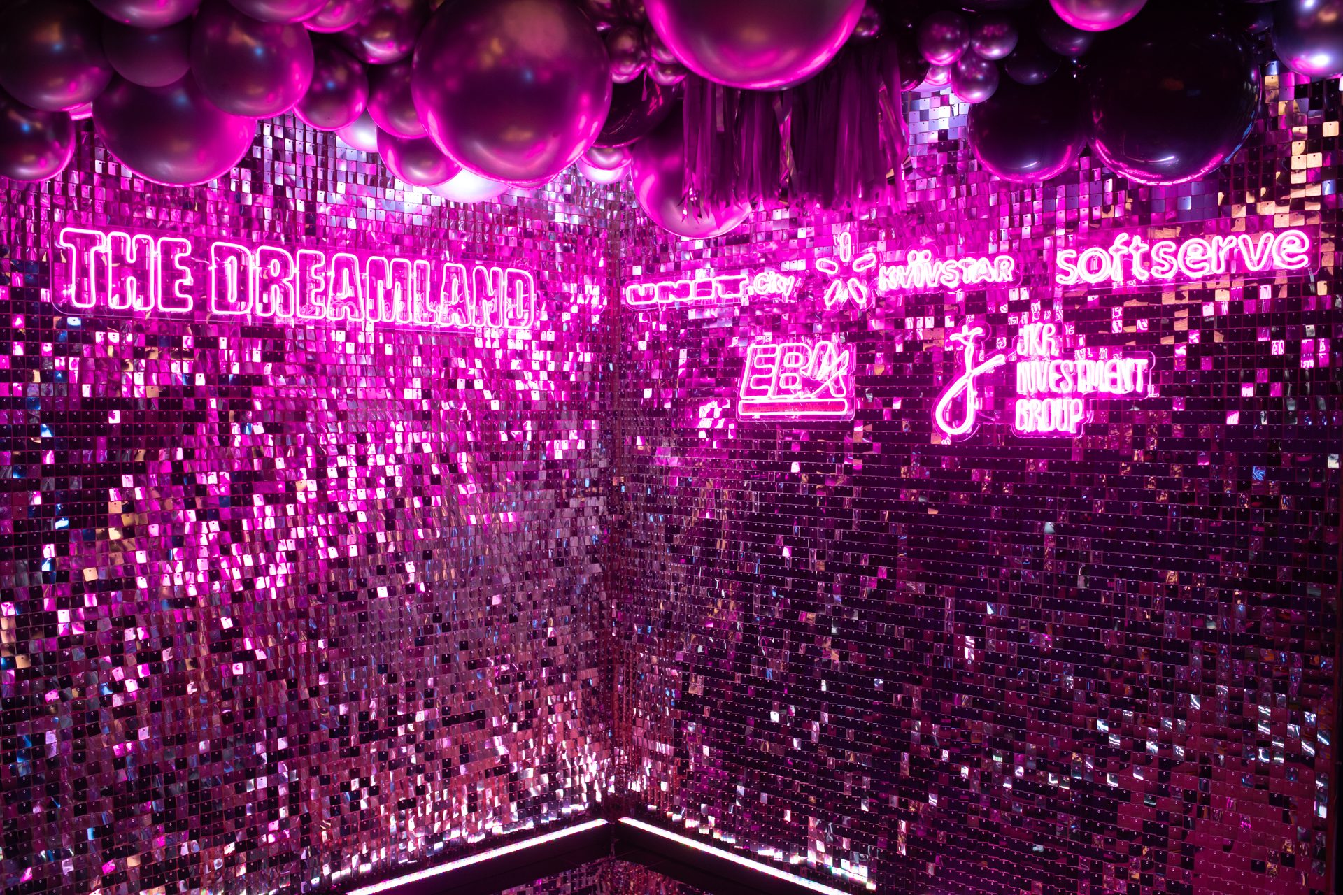 Neon branding installation at an industrial product launch venue