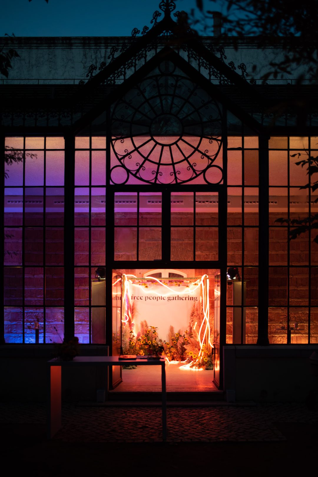 Glass conservatory at dusk—beautiful Cascais venue