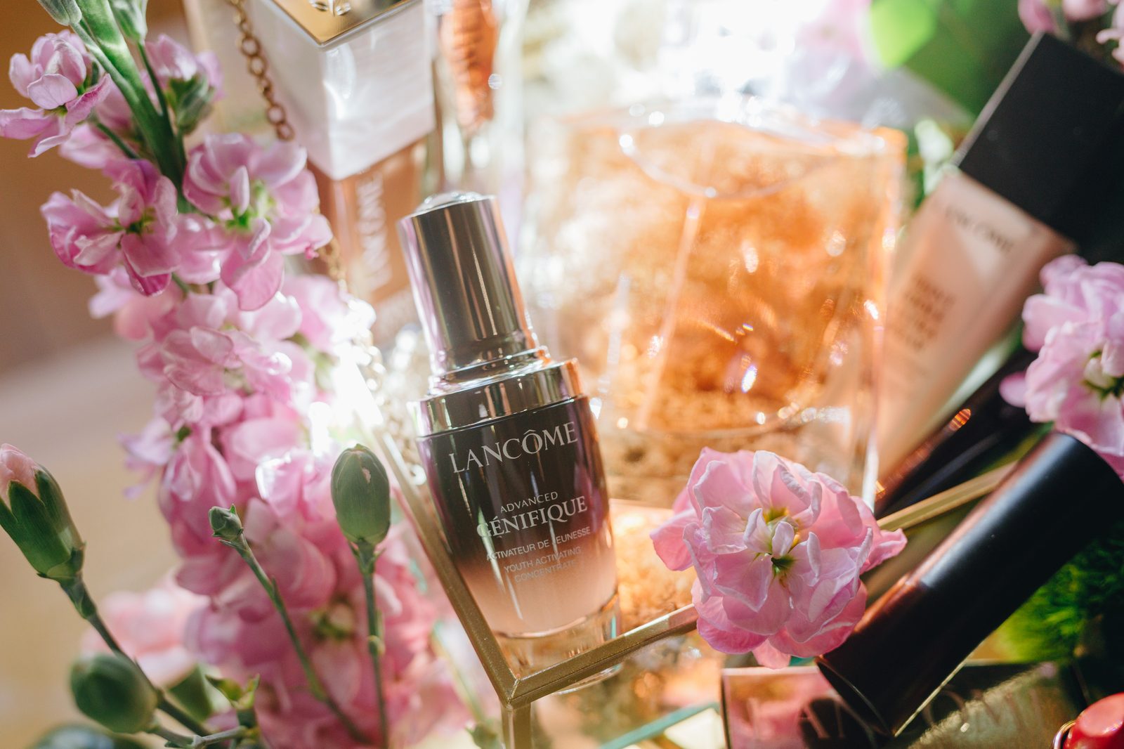 L'Oréal award ceremony stage with floral arrangements in a heritage stone venue