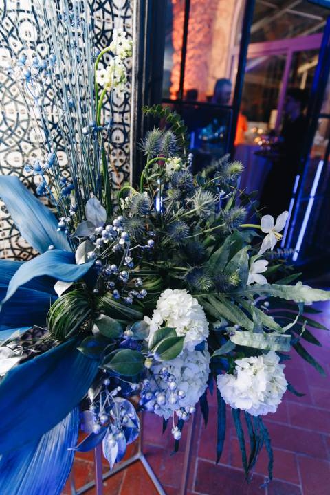 Portuguese botanical centerpieces on a corporate dinner table