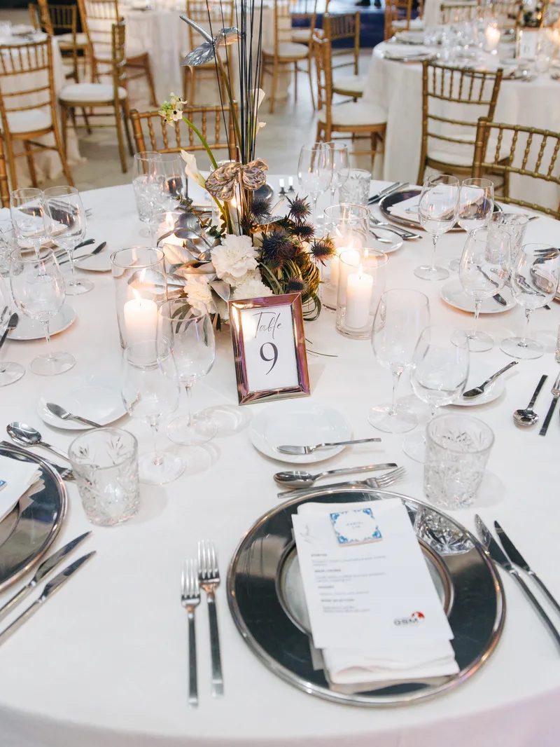 Seated gala dinner with elegant place settings for corporate event