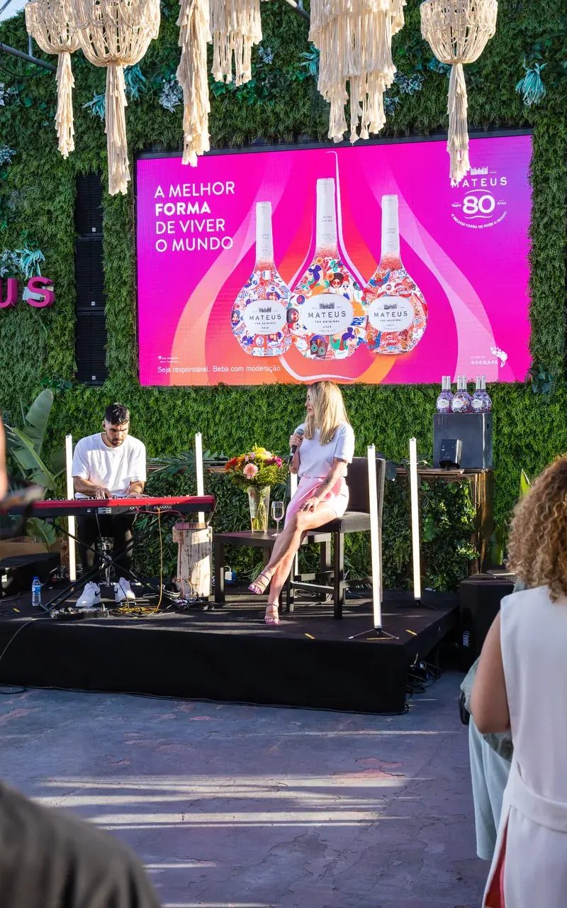 Mateus brand activation stage with green botanical wall