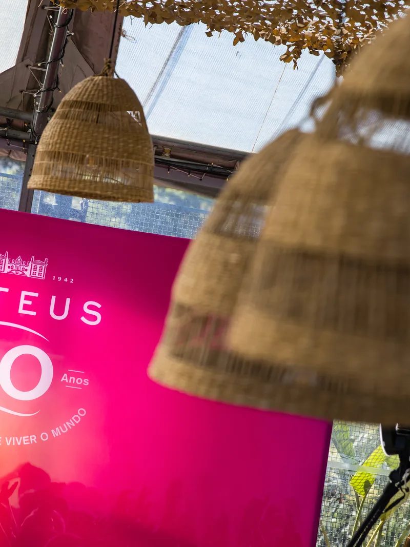 Guests arriving at Mateus Rosé anniversary venue with pink lighting