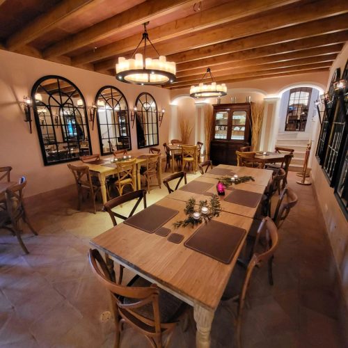 The Adega at Quinta da Bella Vista, Sintra · wine-cellar tavern with vaulted ceiling set for dinner